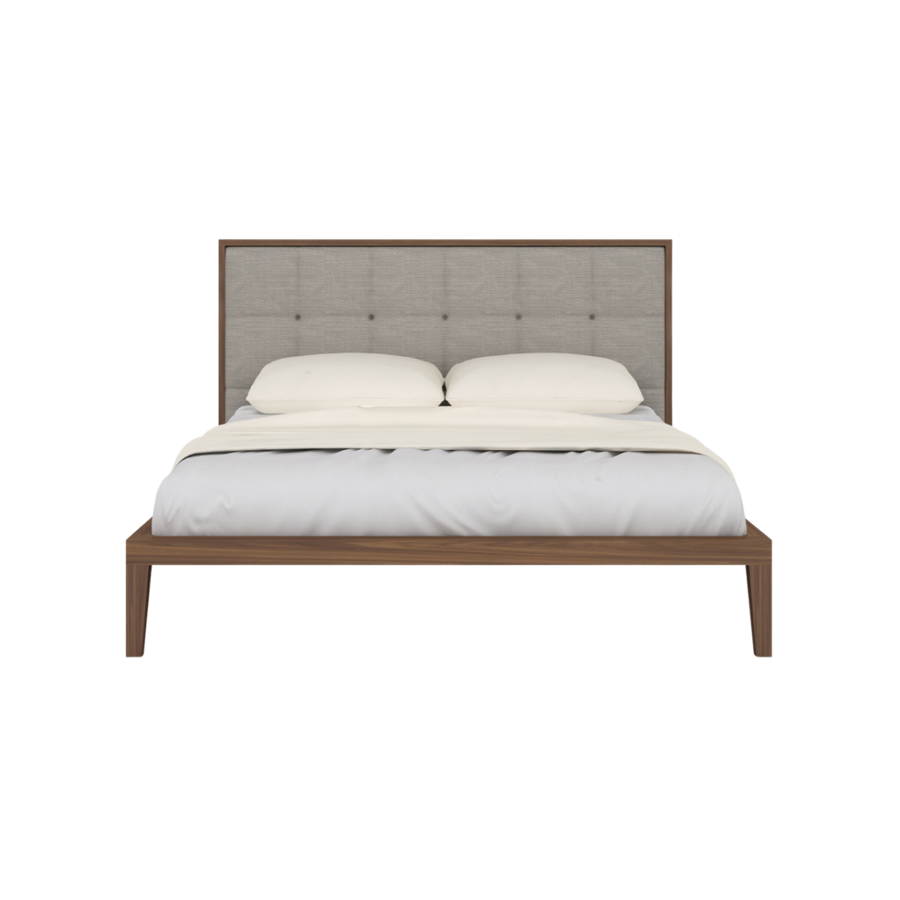 Bed with wooden frame and upholstered headboard on a white background