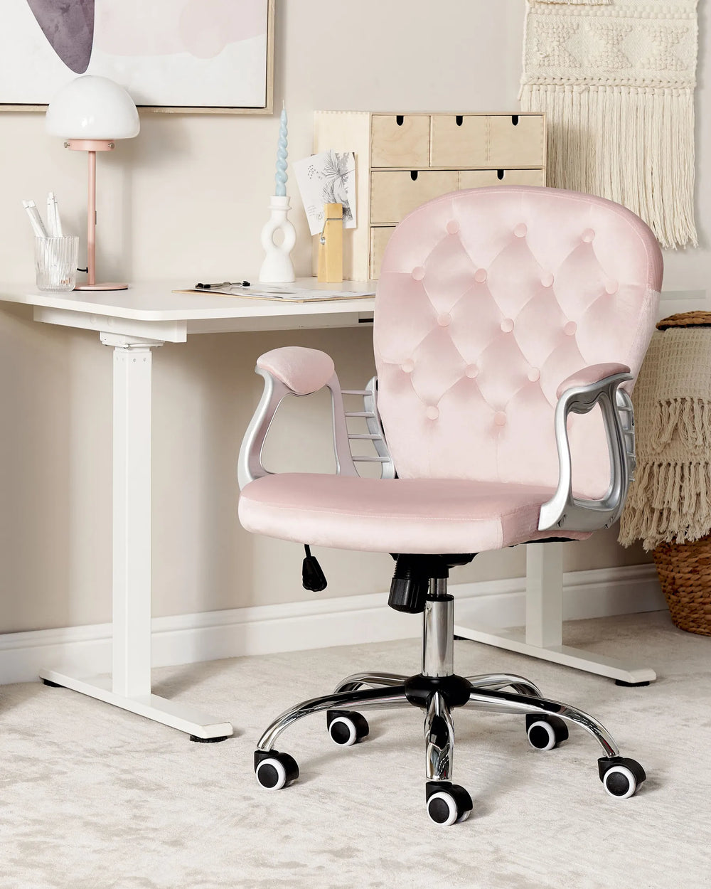 Pink office chair in a home office setting with a desk and decor.