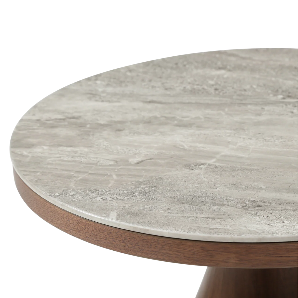 Round table with a marble-like top and wooden base on a white background