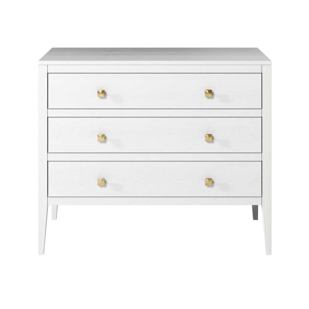 White dresser with gold knobs on a white background