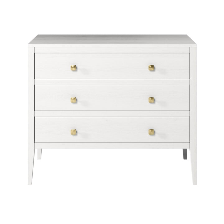 White dresser with gold knobs on a white background