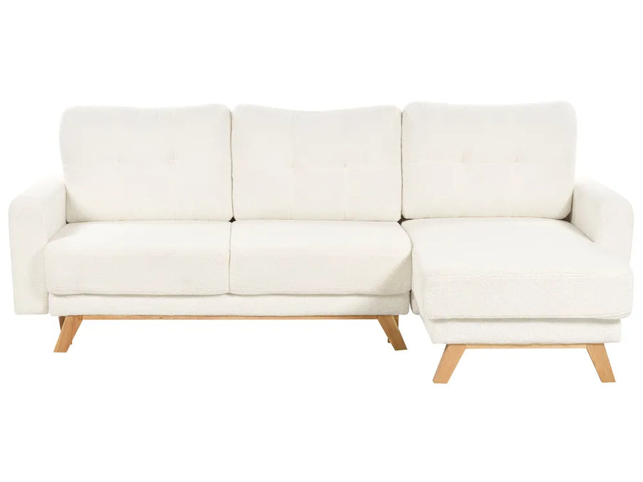 Modern off-white corner sofa with fold-out bed and storage