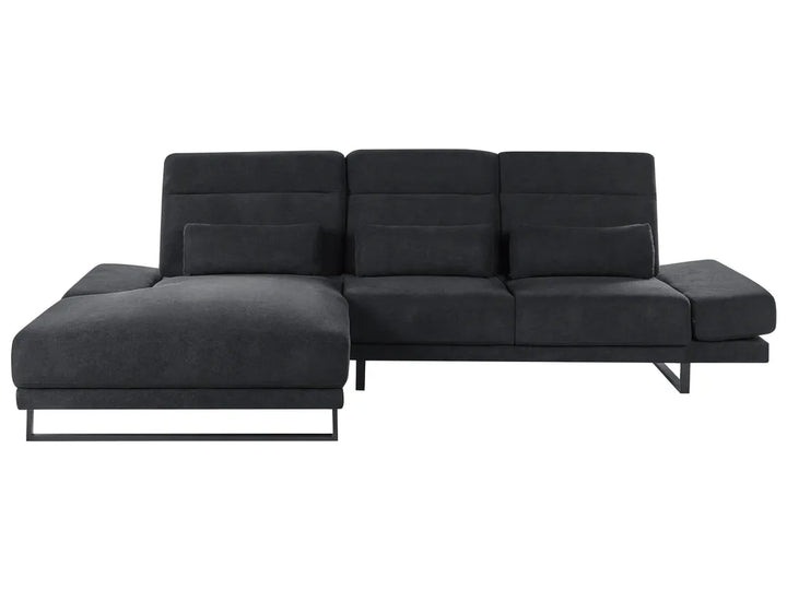 Black fabric right-hand corner sofa with adjustable backrests and headrest in a modern living room