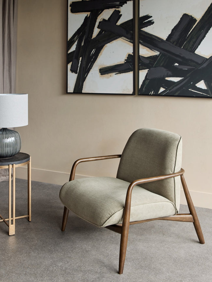 Modern armchair in a room with abstract art on the wall