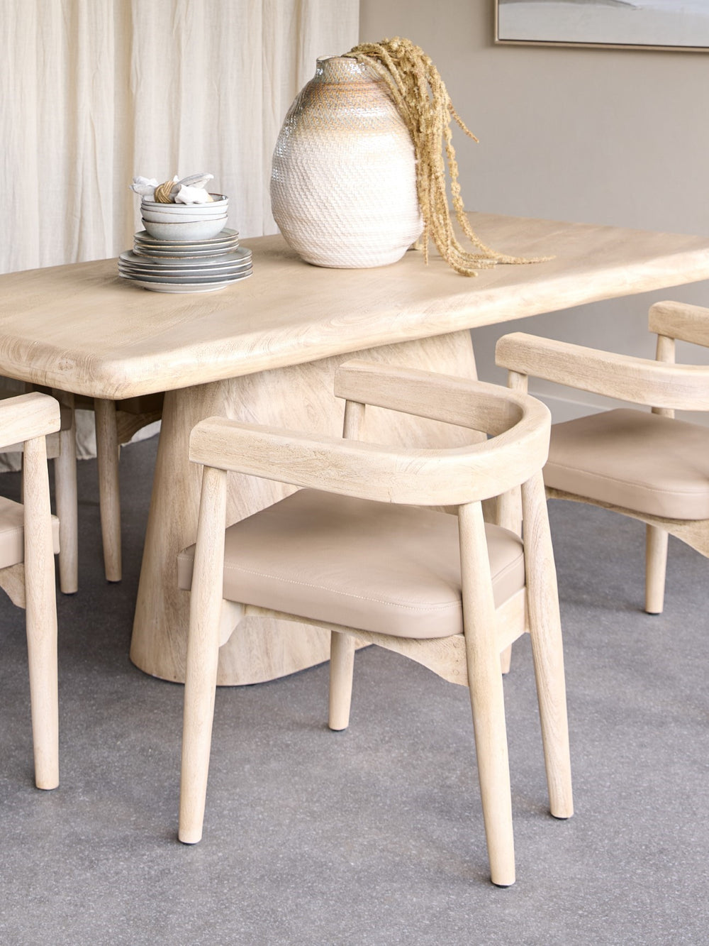 Dining table with chairs in a room setting