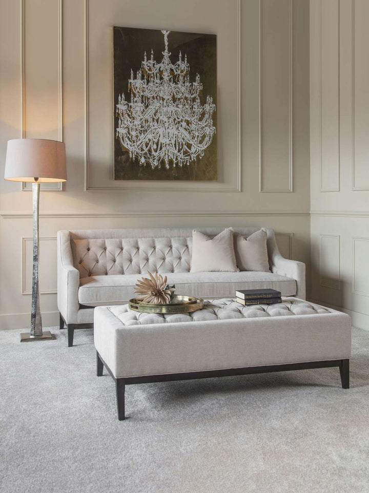 Luxury ivory upholstered ottoman with deep buttoning