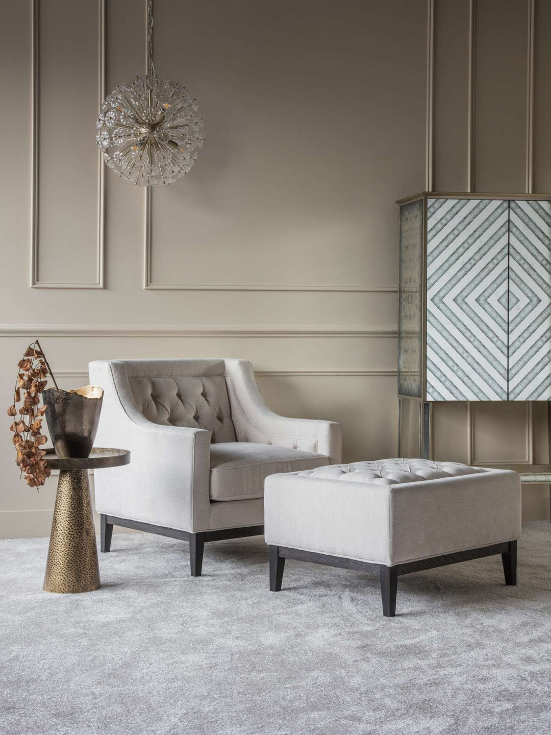 Ivory fabric buttoned footstool with piped edges and dark wooden legs