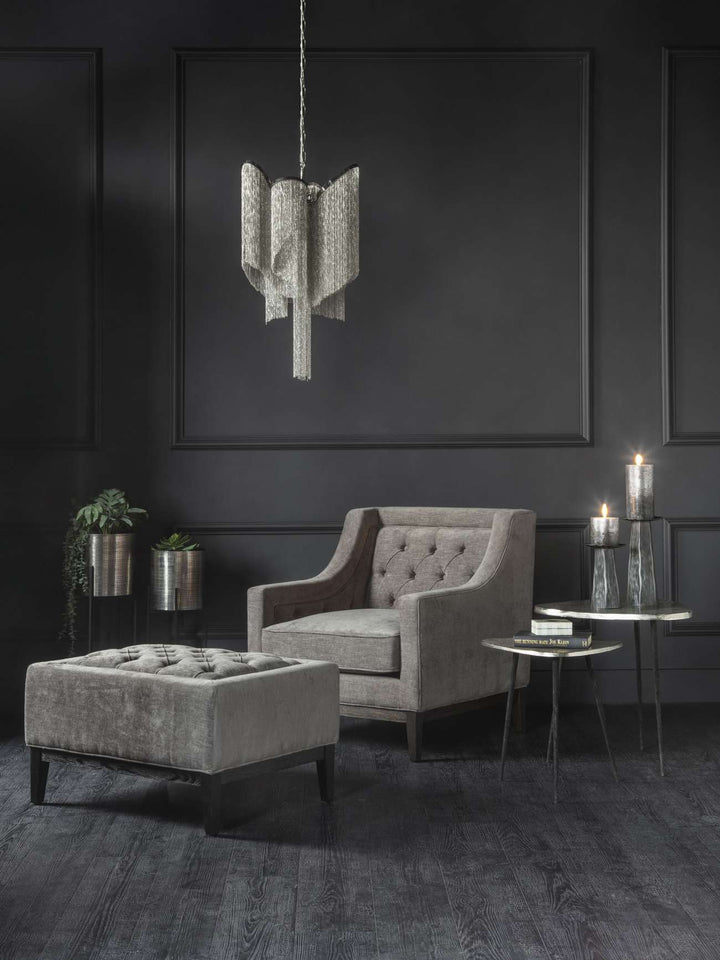 Deep buttoning and tactile woven fabric on Libra Theodore warm grey stool