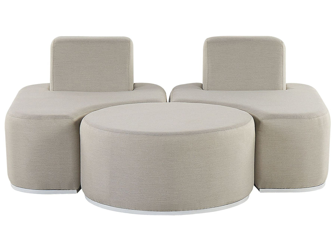 Beige modular sofa set with two chairs and a round ottoman on a white background