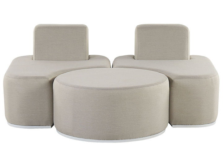 Beige modular sofa set with two chairs and a round ottoman on a white background