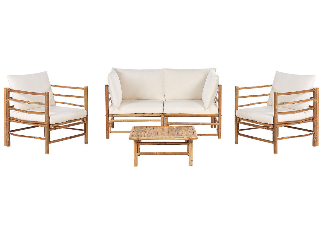 A bamboo wood garden lounge set with off-white cushions, including a sofa, two armchairs, and a rectangular coffee table.