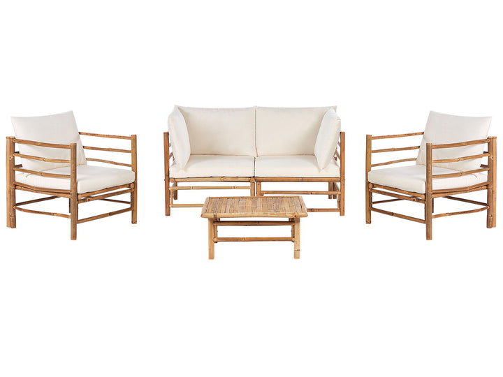 A bamboo wood garden lounge set with off-white cushions, including a sofa, two armchairs, and a rectangular coffee table.