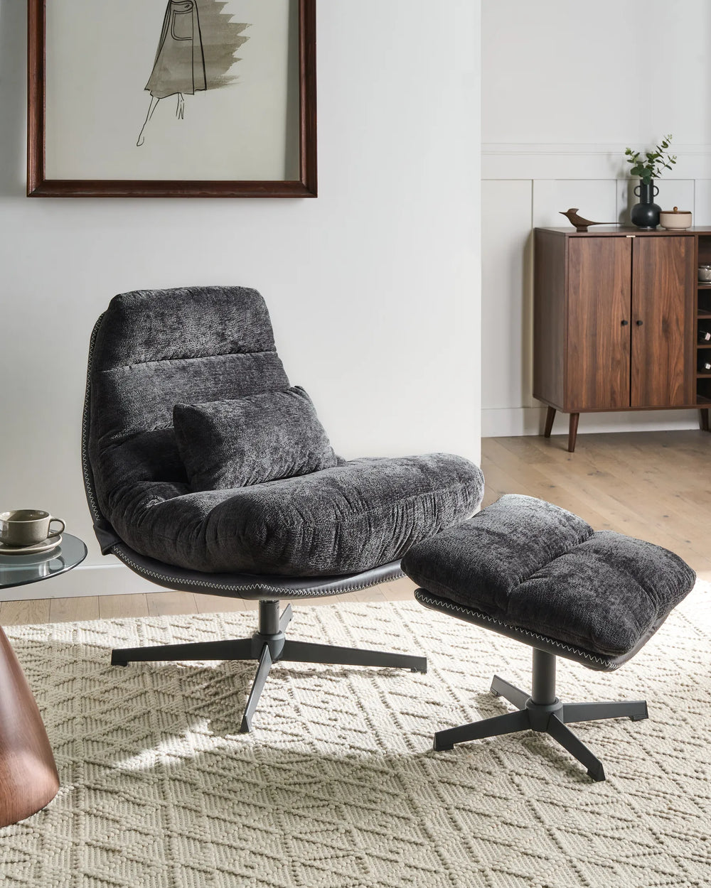Gray armchair with ottoman in a living room setting