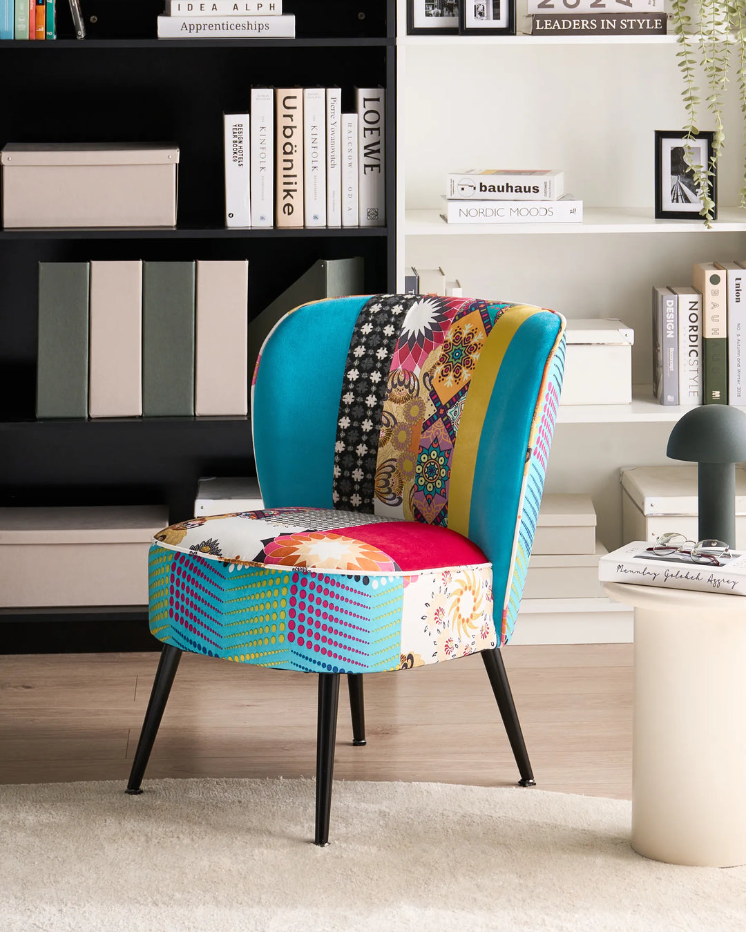 Colorful patchwork chair in a room with books and decor