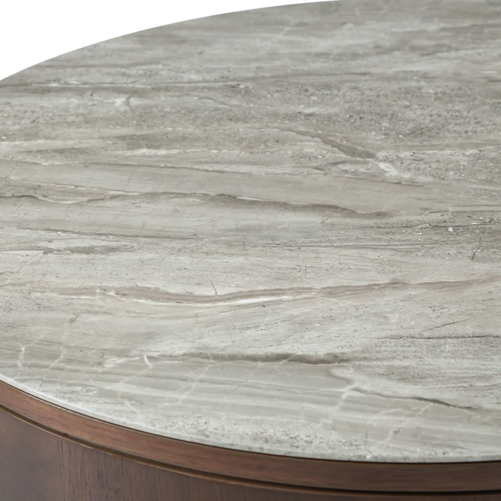 Round marble table with a gray veined surface