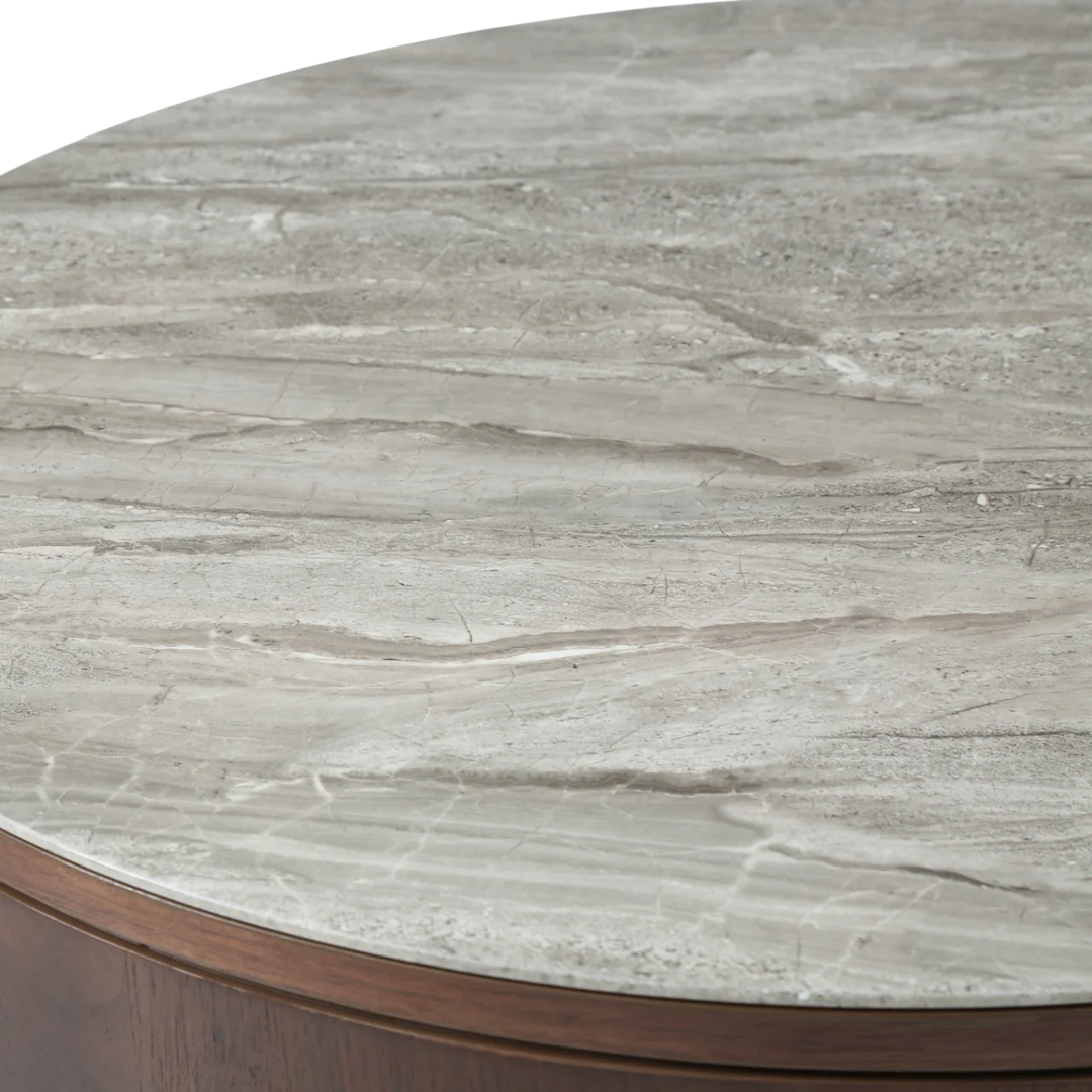 Round marble table with a gray veined surface