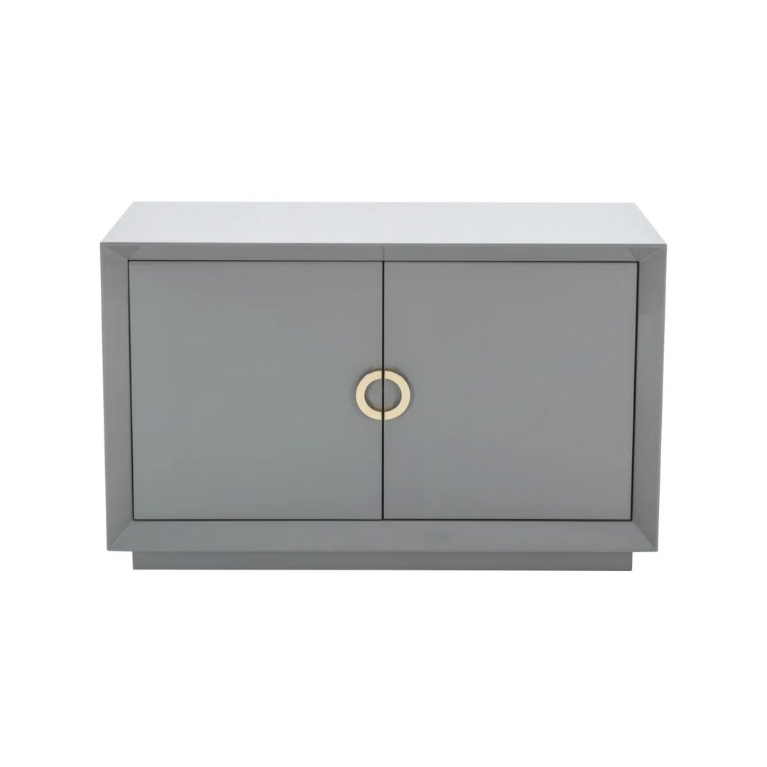 Gray cabinet with two doors and a gold handle on a white background