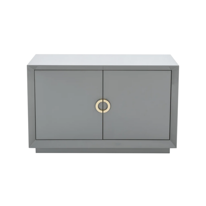 Gray cabinet with two doors and a gold handle on a white background