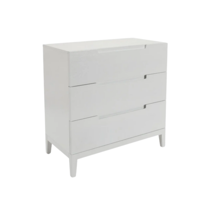 White dresser with three drawers on a white background
