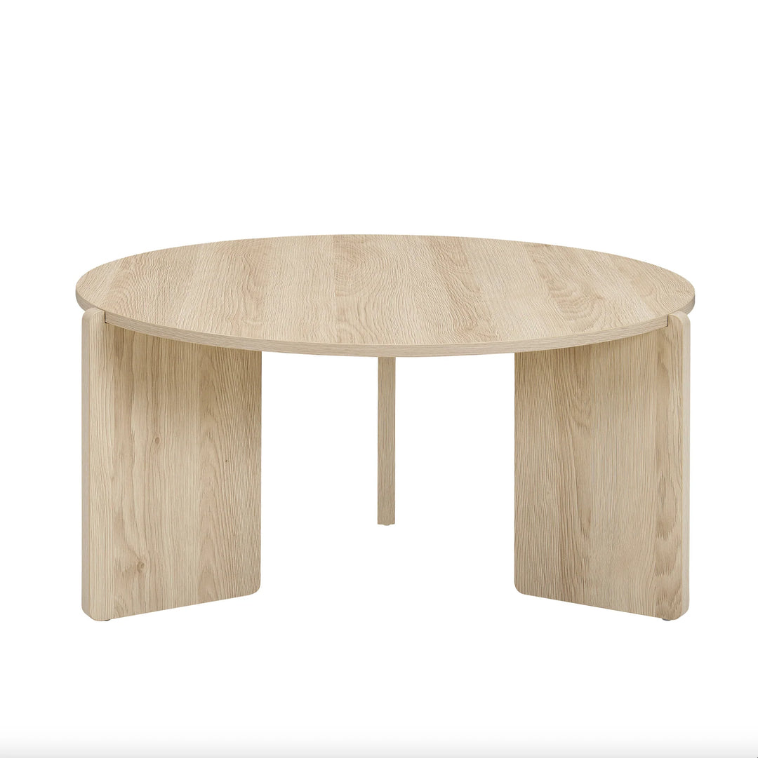 Round wooden table on a white background