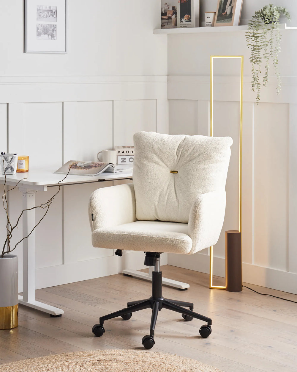 Beige office chair in a modern office setting with a desk and decor.