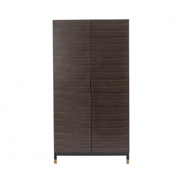 Dark wooden wardrobe with gold feet on a white background