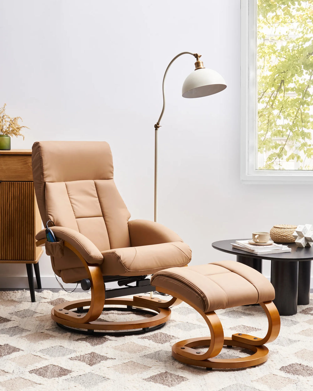 Beige recliner chair with ottoman in a living room setting