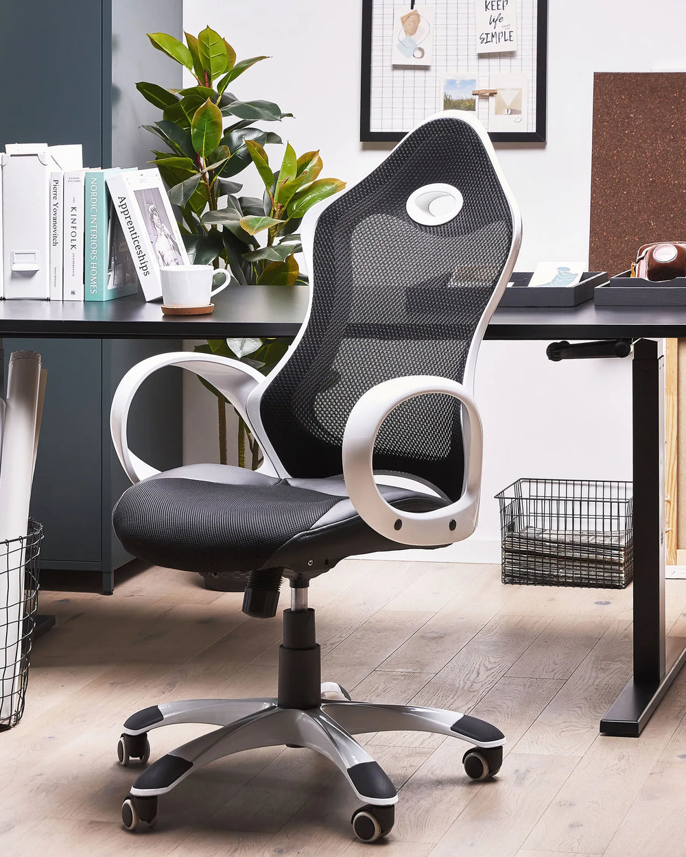 Ergonomic office chair in a home office setting with a desk and decor.