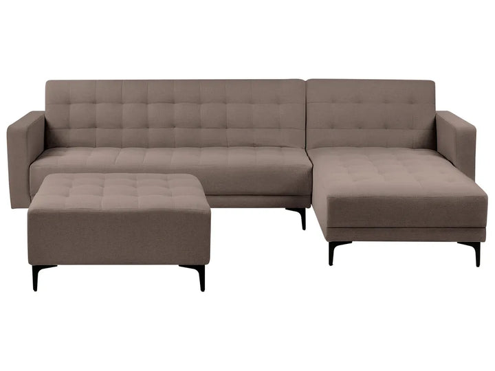 Brown sectional sofa with ottoman on a white background