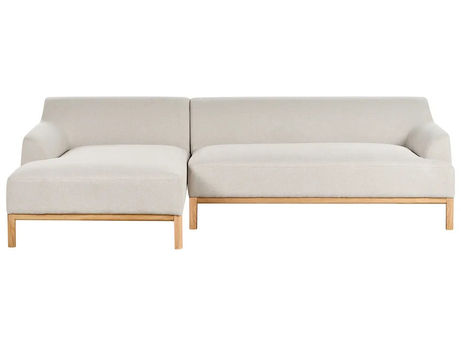 Beige sectional sofa on a white background