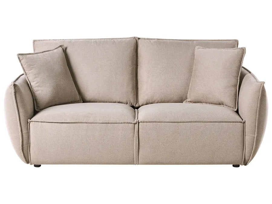 Beige sofa with two cushions on a white background