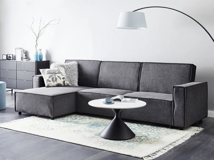 Modern right-hand corner sofa bed in graphite grey fabric with versatile chaise