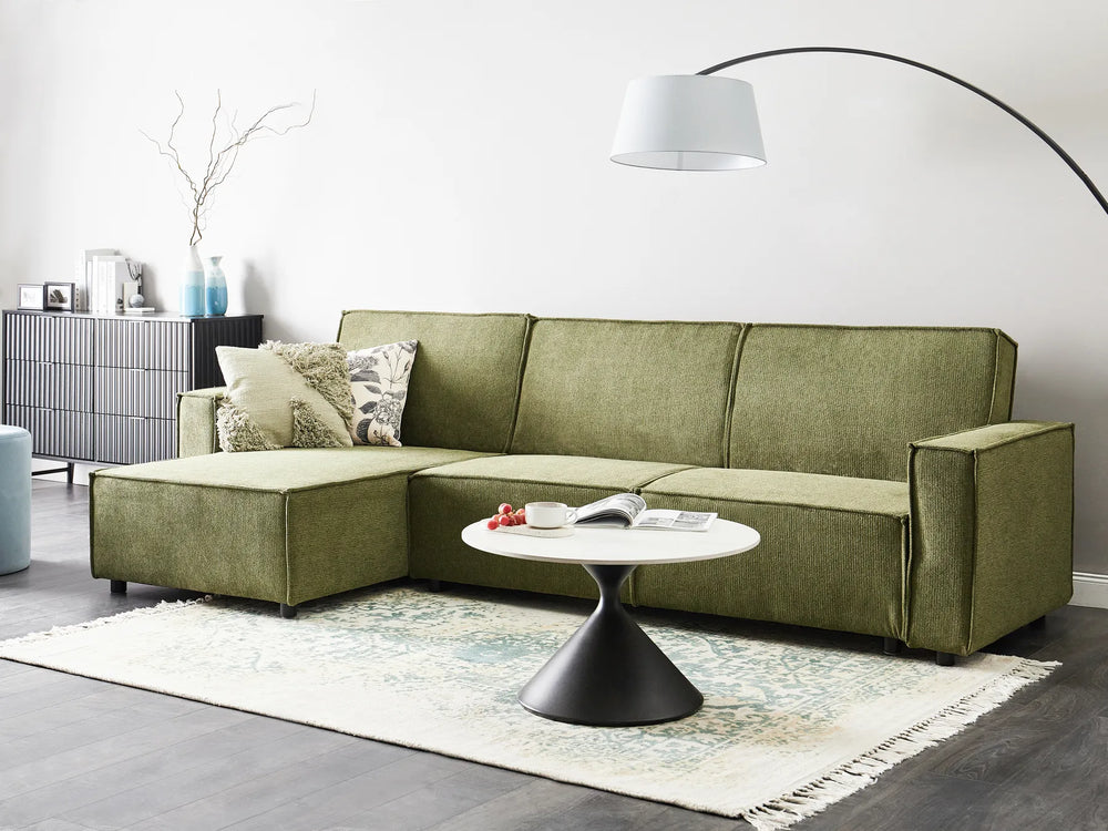 Modern right-hand corner sofa bed in dark green fabric with versatile chaise