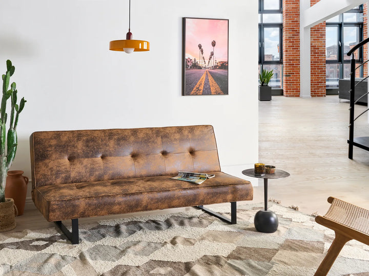 Modern sofa bed with metal sled base and leather-look upholstery