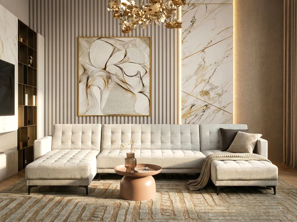 Luxurious living room with a beige sofa, marble wall, and abstract art.