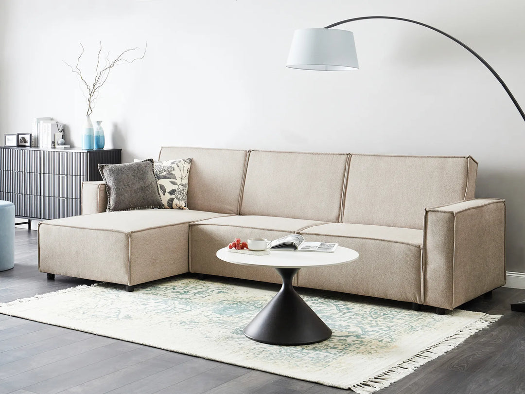 Modern right-hand corner sofa bed in beige fabric with versatile chaise