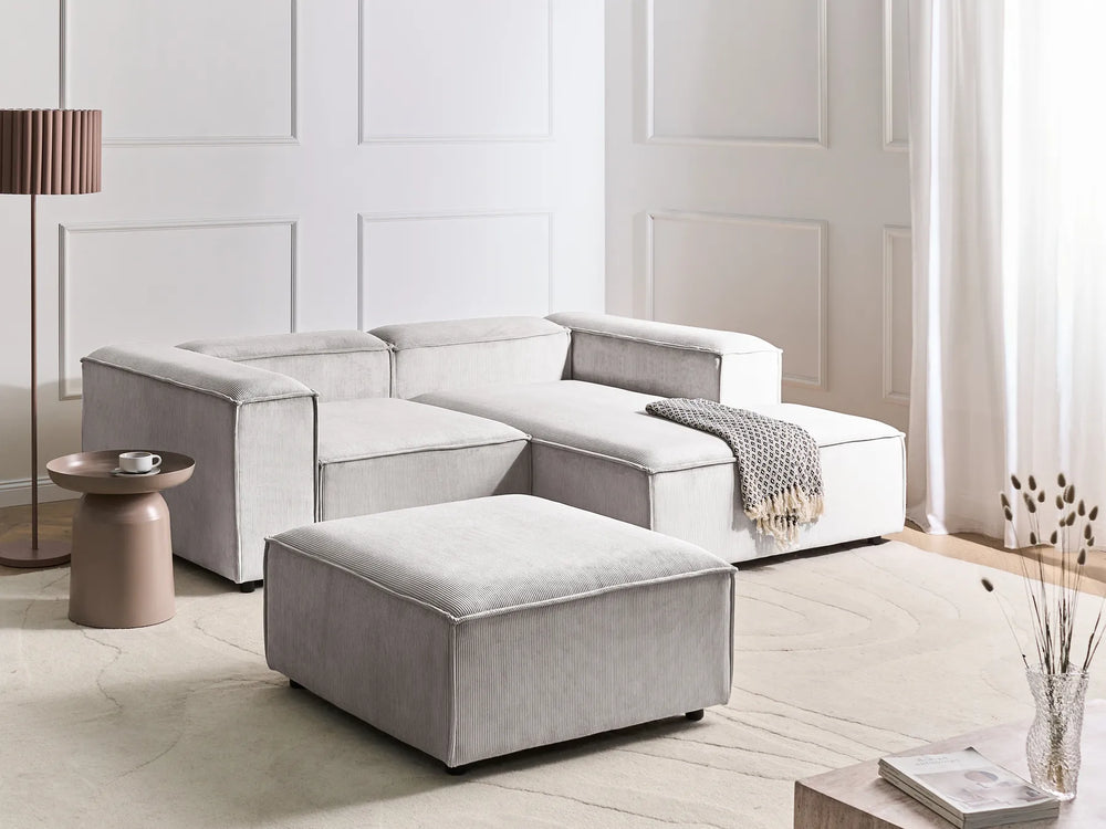 3-seater L-shaped off-white corduroy corner sofa with ottoman, soft ribbed upholstery and contemporary design