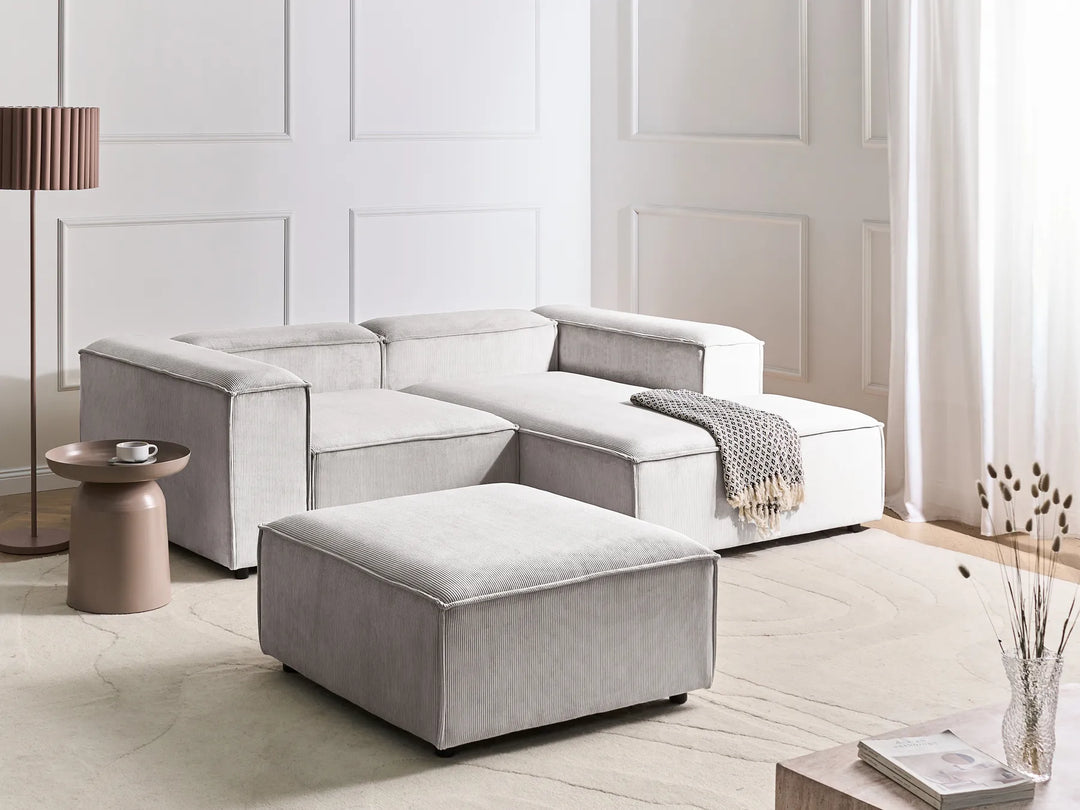 3-seater L-shaped off-white corduroy corner sofa with ottoman, soft ribbed upholstery and contemporary design