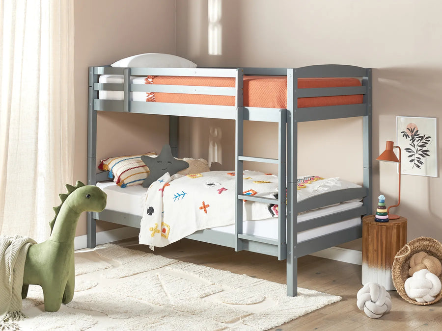 Children's room with a gray bunk bed, dinosaur toy, and decorative items.