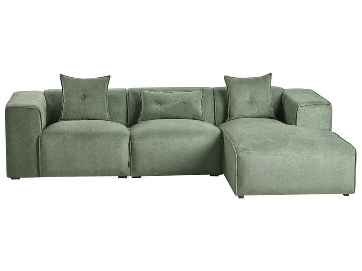 Green sectional sofa with cushions on a white background