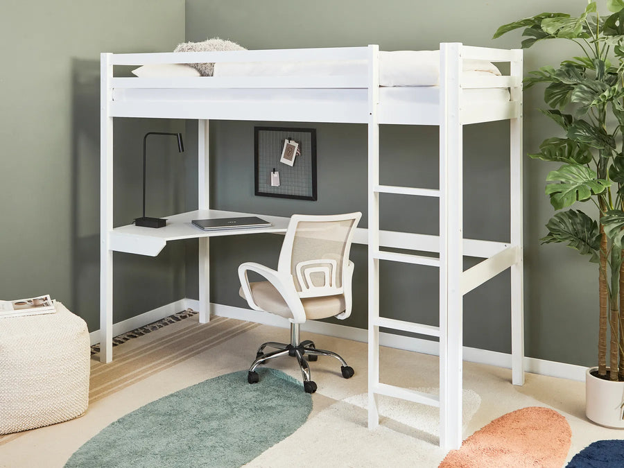 White loft bed with desk and chair in a room with a green wall and plant.