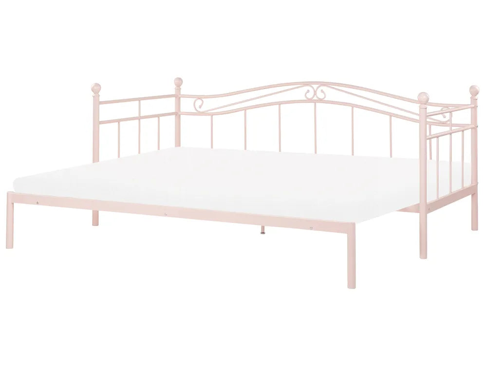 Pink metal bed frame with white mattress on a white background
