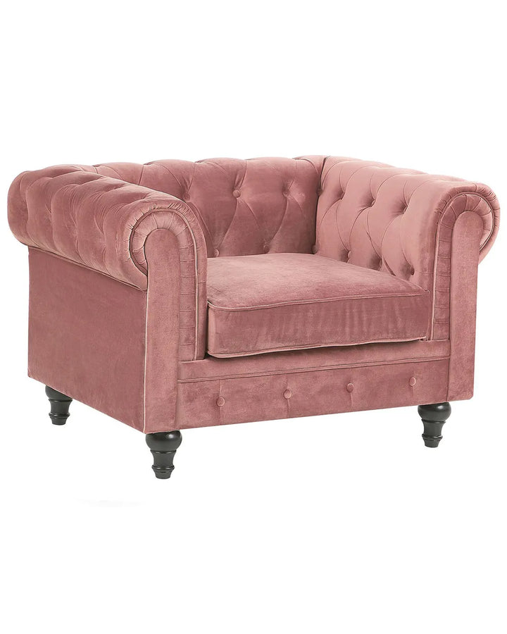 Pink velvet armchair on a white background