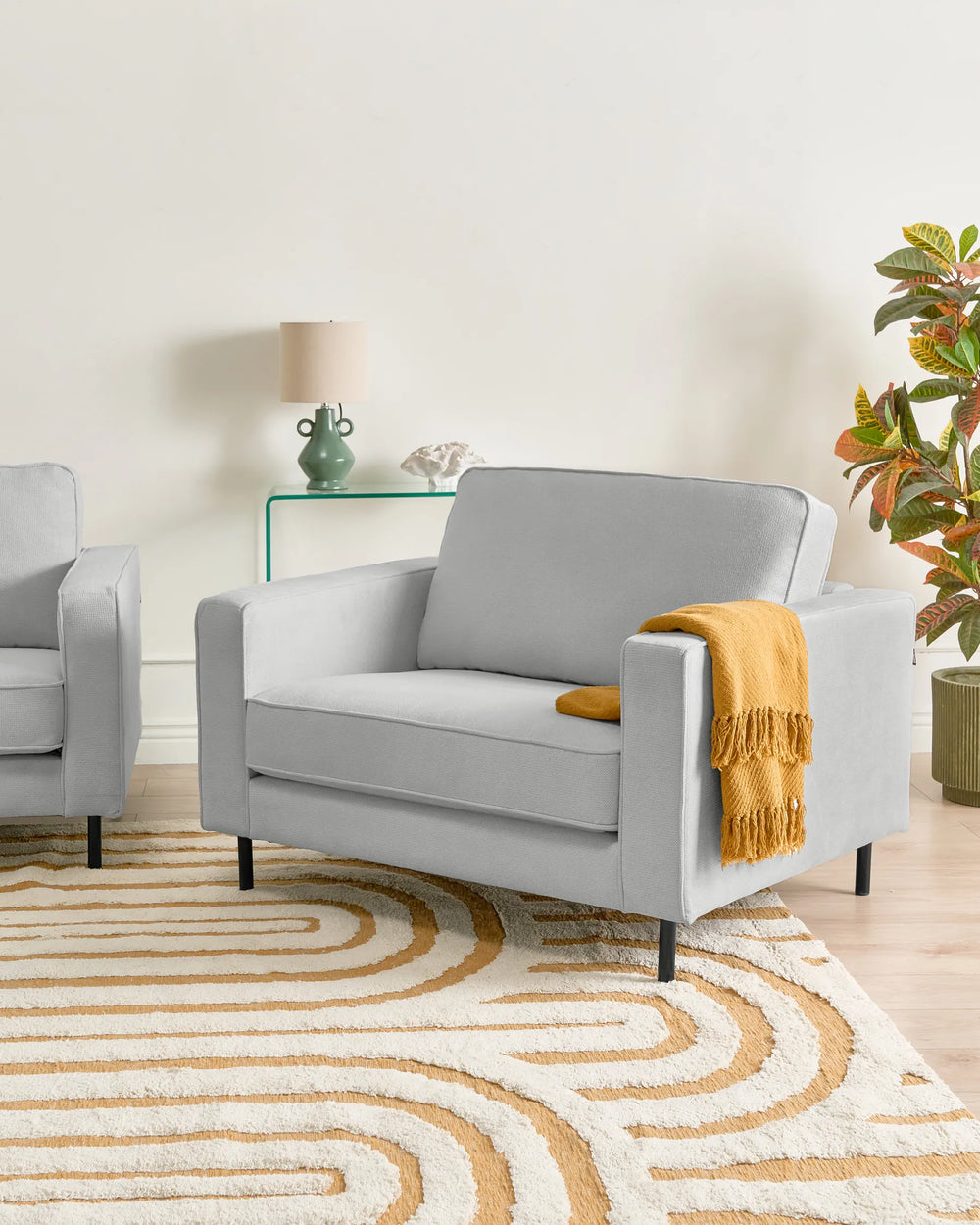 Upholstered in soft light grey fabric.
