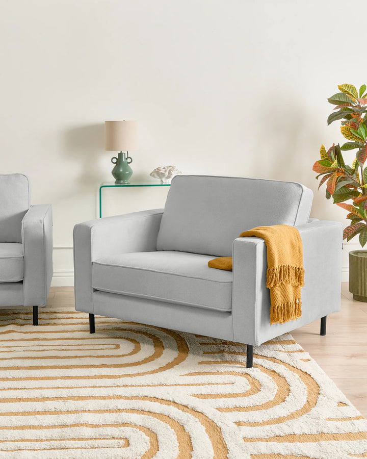 Upholstered in soft light grey fabric.