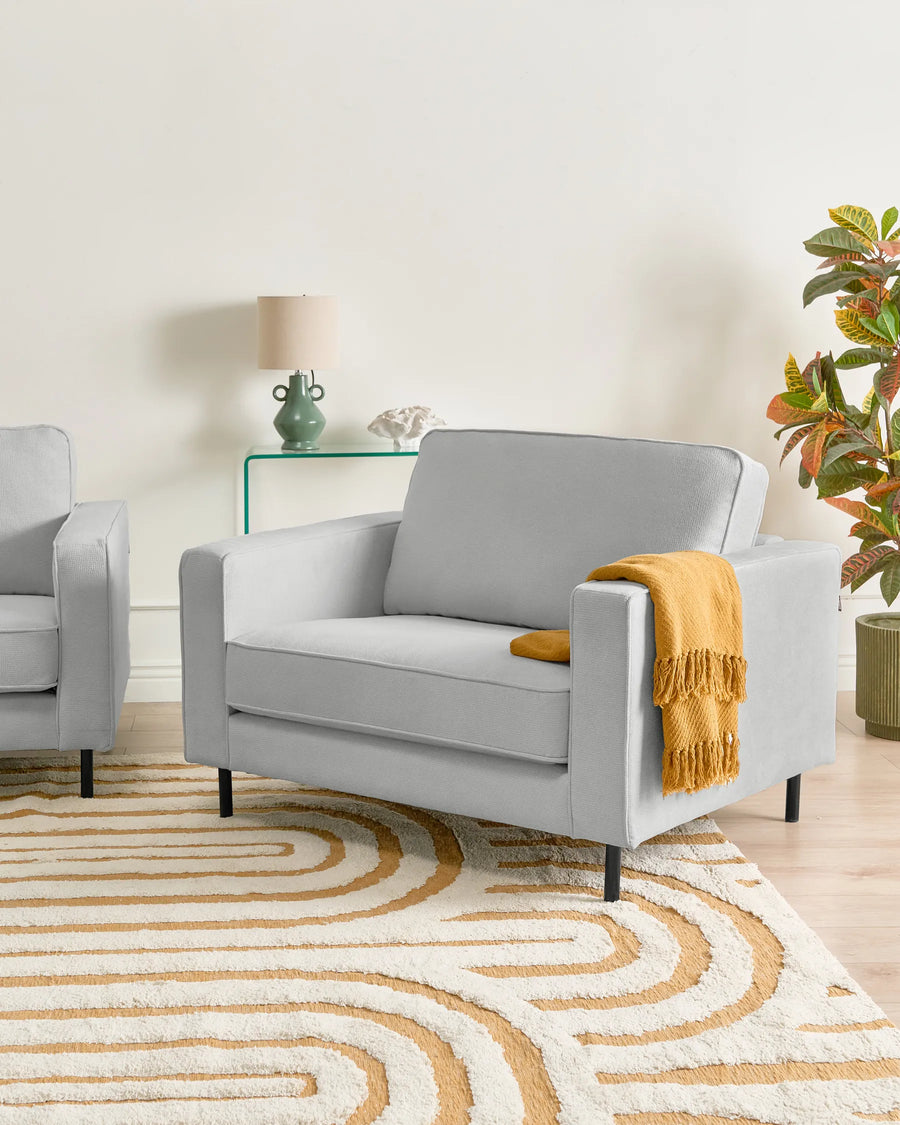 Upholstered in soft light grey fabric.