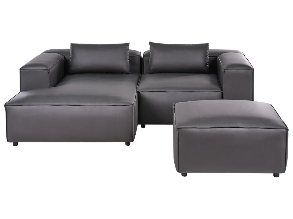 Gray sectional sofa with ottoman on a white background