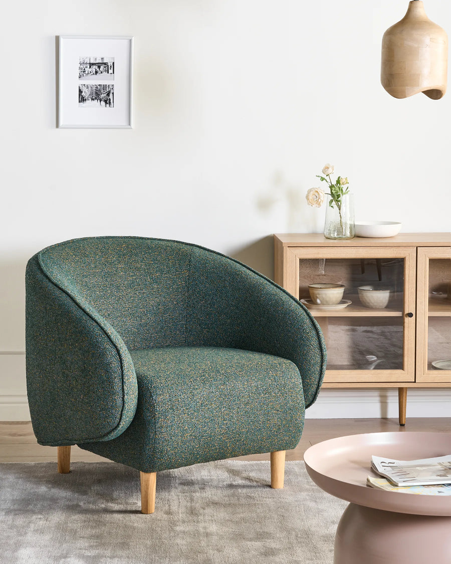 Upholstered in quality fabric in a refined green tone.