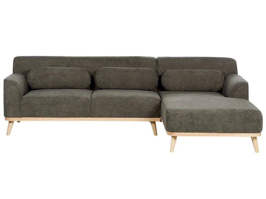 Gray sectional sofa with wooden legs on a white background