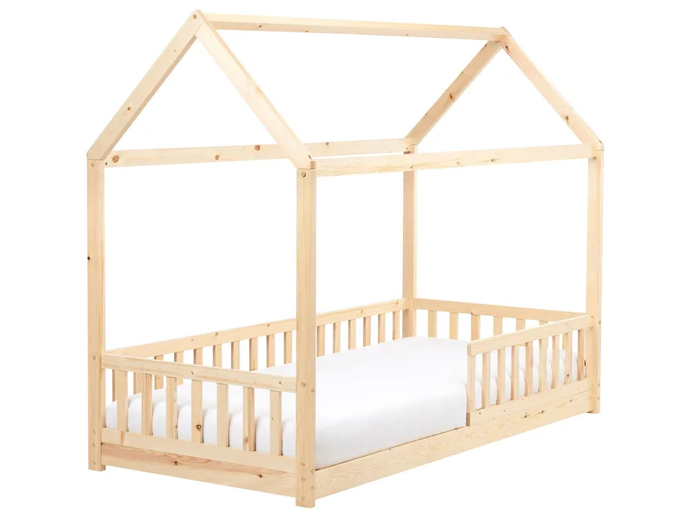 Wooden children's bed with a house-shaped top on a white background